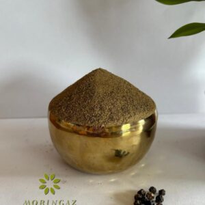 Fresh black pepper powder in a glass jar with peppercorns—pure, natural spice for enhanced digestion and metabolism.