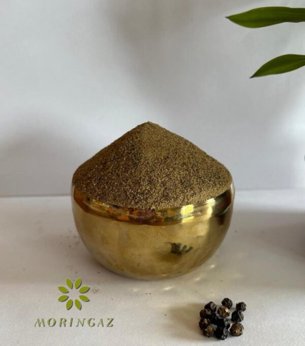Fresh black pepper powder in a glass jar with peppercorns—pure, natural spice for enhanced digestion and metabolism.